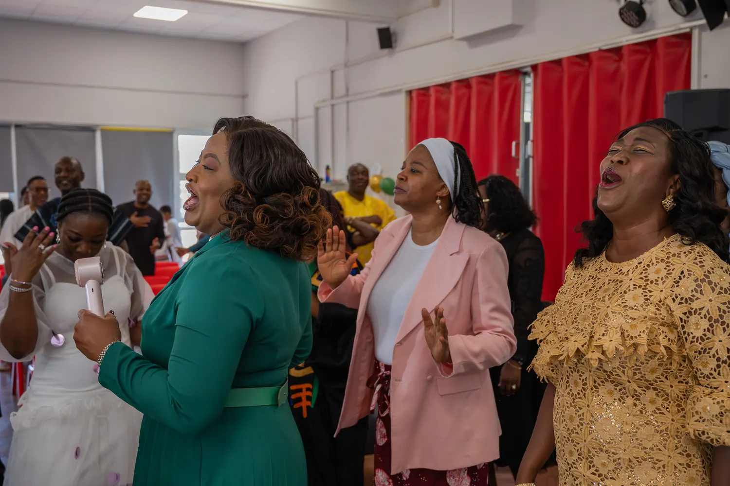 Worshippers singing together at Victory Centre